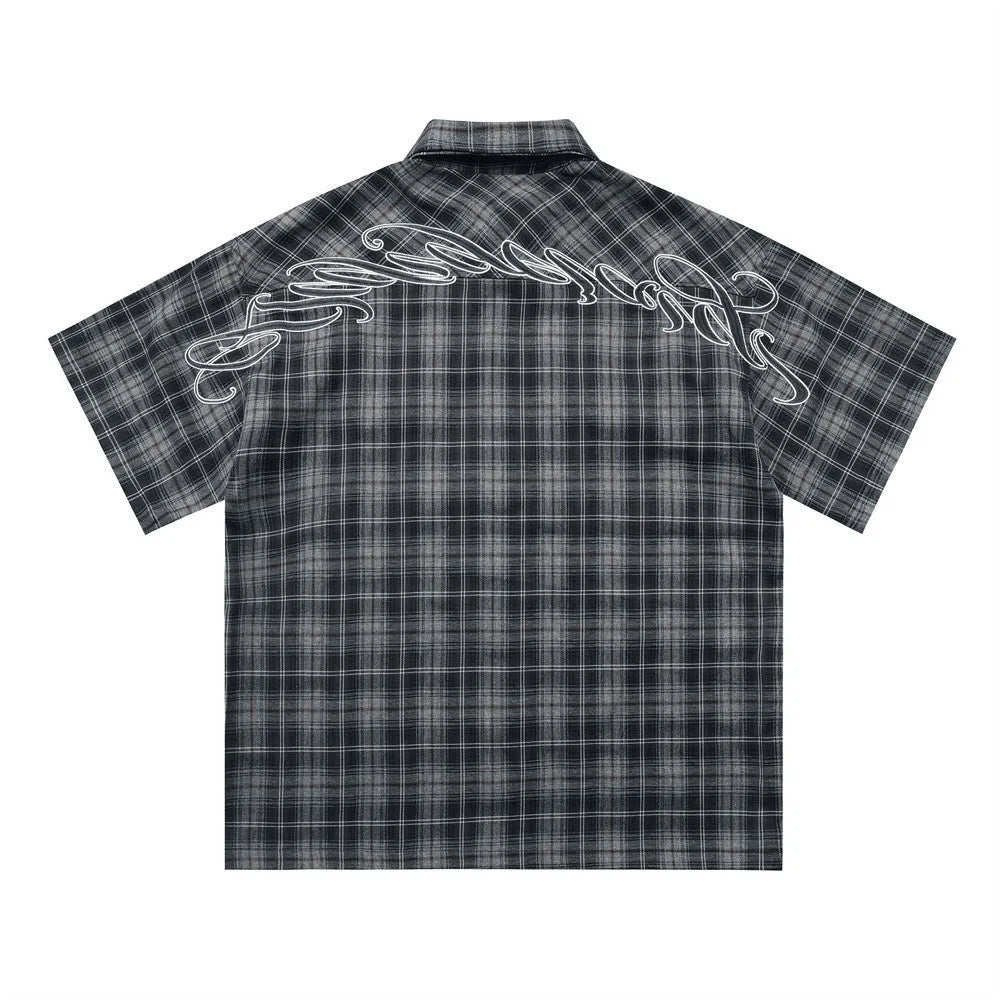 Men's black plaid shirt with embroidered letter design on chest, short sleeves, and lapel collar
