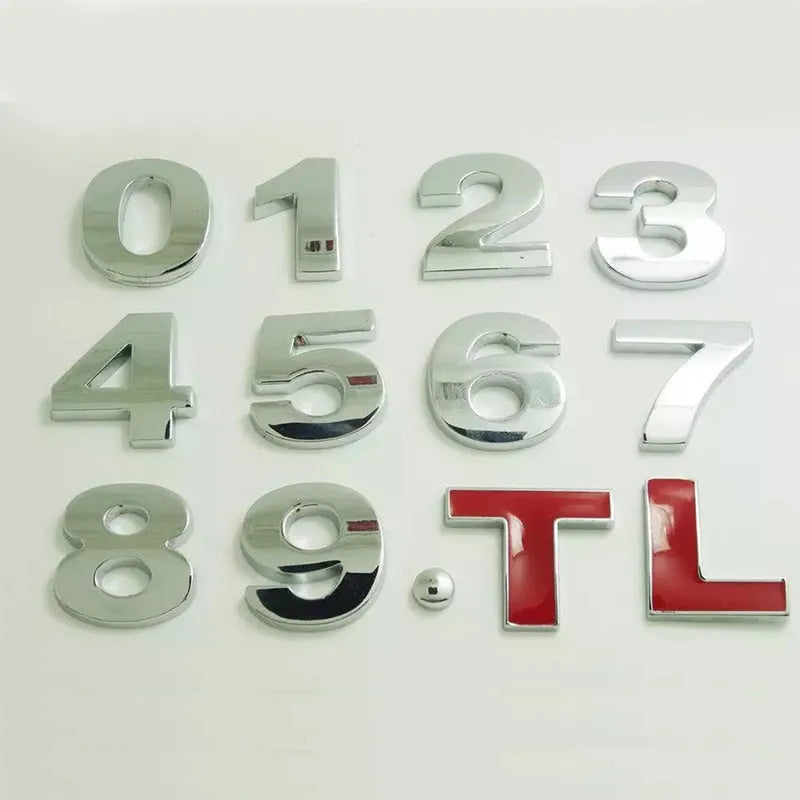 Close-up of a 3D metal zinc alloy letter 'A' car bumper sticker in silver finish.