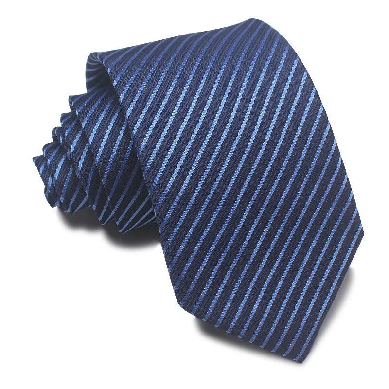 Close-up of a red, black, and blue striped men's formal tie with a textured Jacquard weave.