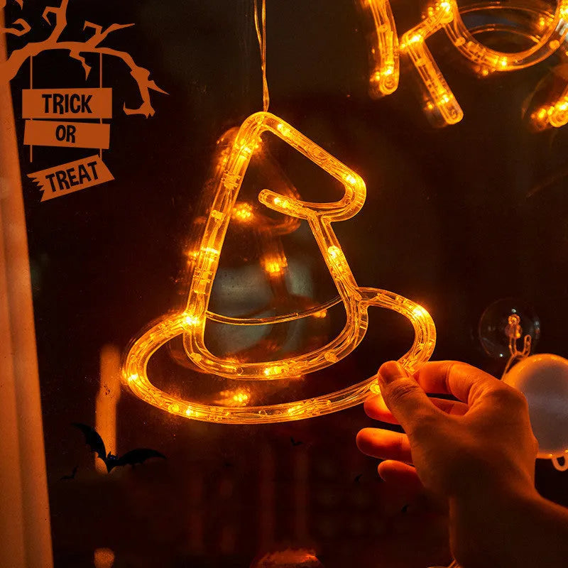 Halloween window hanging LED lights with seven designs including spider, pumpkin, ghost, and bat motifs