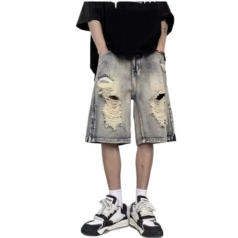 Blue distressed denim shorts with wide-leg loose fit and retro tattered styling on hanger