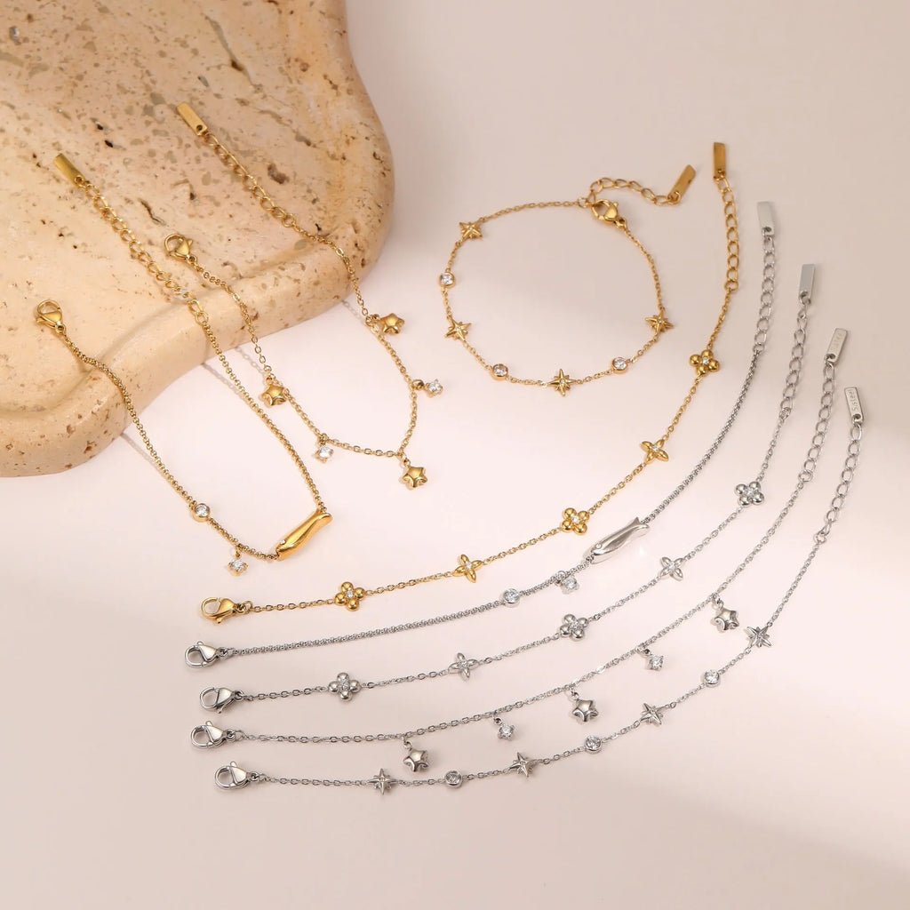 Stainless steel women's bracelet with geometric star pendant featuring hexagonal elements and gold plating