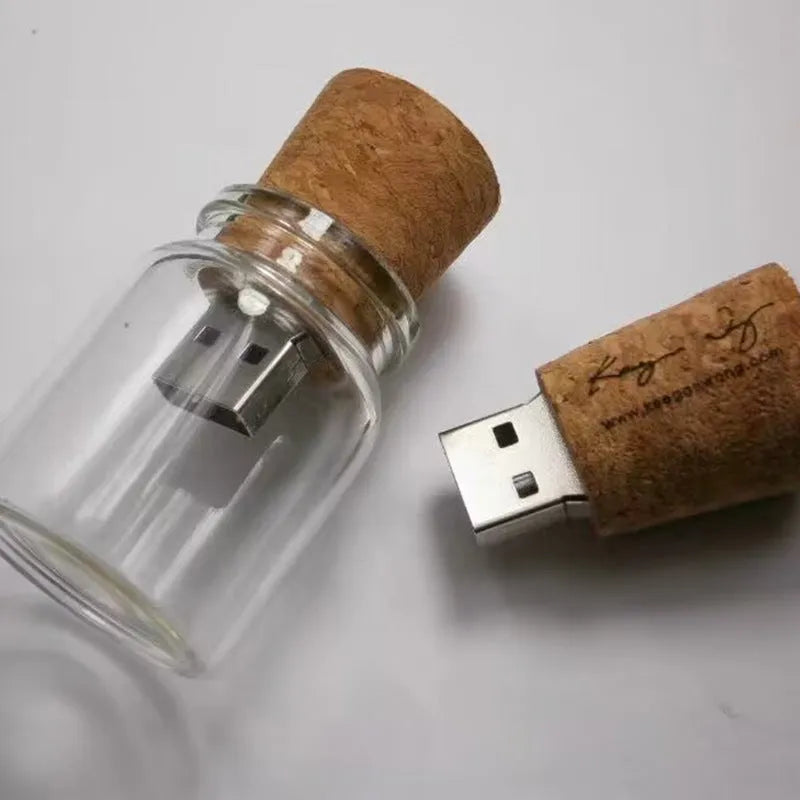 Transparent glass bottle USB flash drive with a wooden stopper cap, 60mm long.