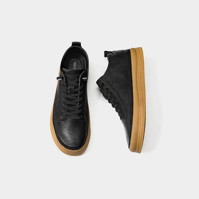 Men's black casual leather shoes with round toe and lanyard closure on soft rubber soles