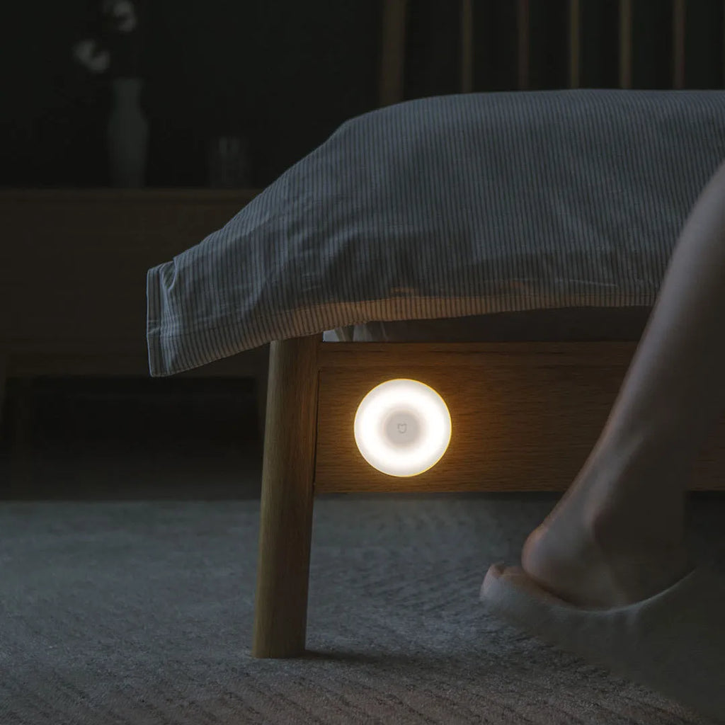 White Mijia Night Light 2 Bluetooth lamp with PC shade and inductive sensor on bedside table