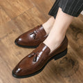 Men's black slip-on business shoes with tassel detail on artificial leather upper