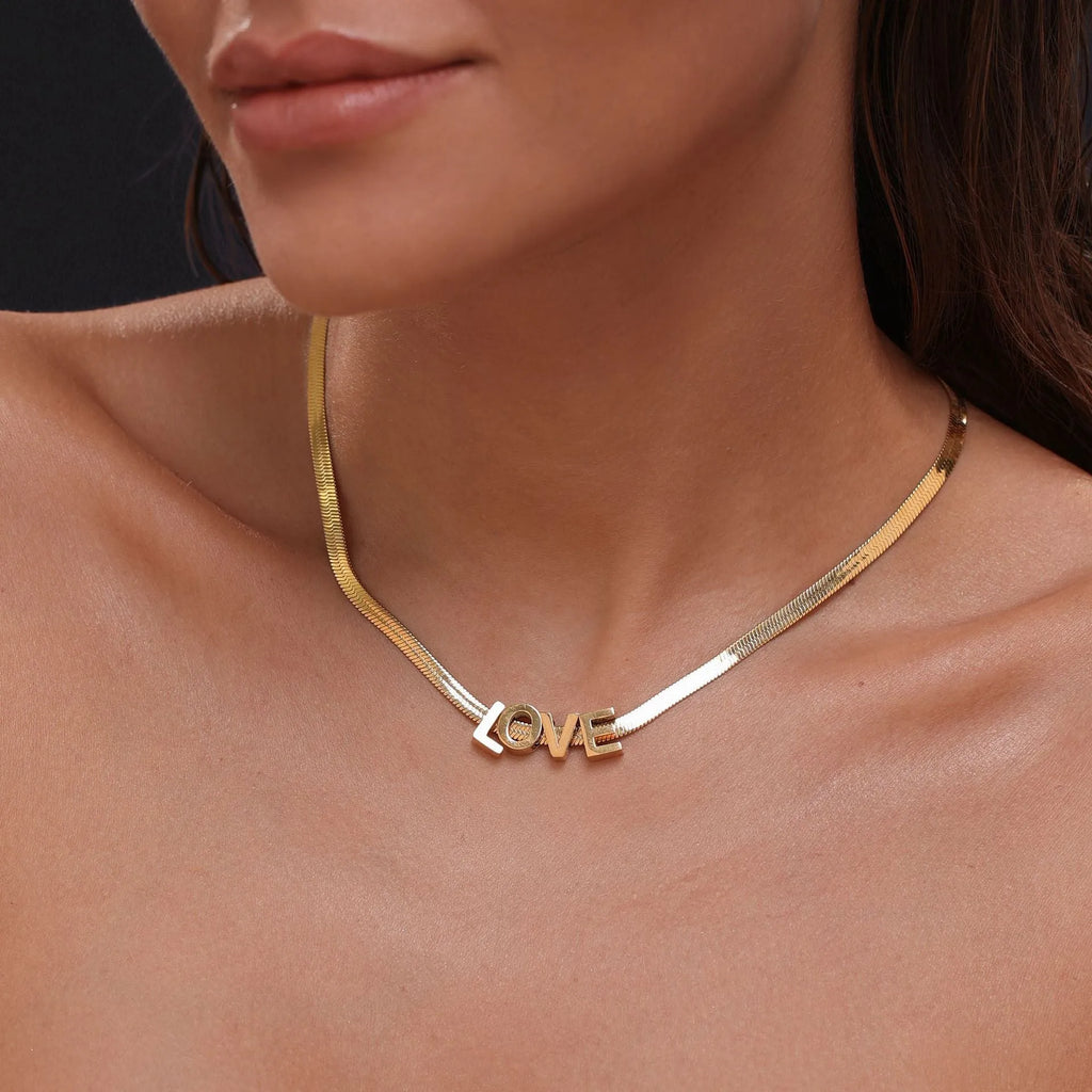 Titanium steel personalised necklace with a charm showing the letter A on a 40.5cm chain.