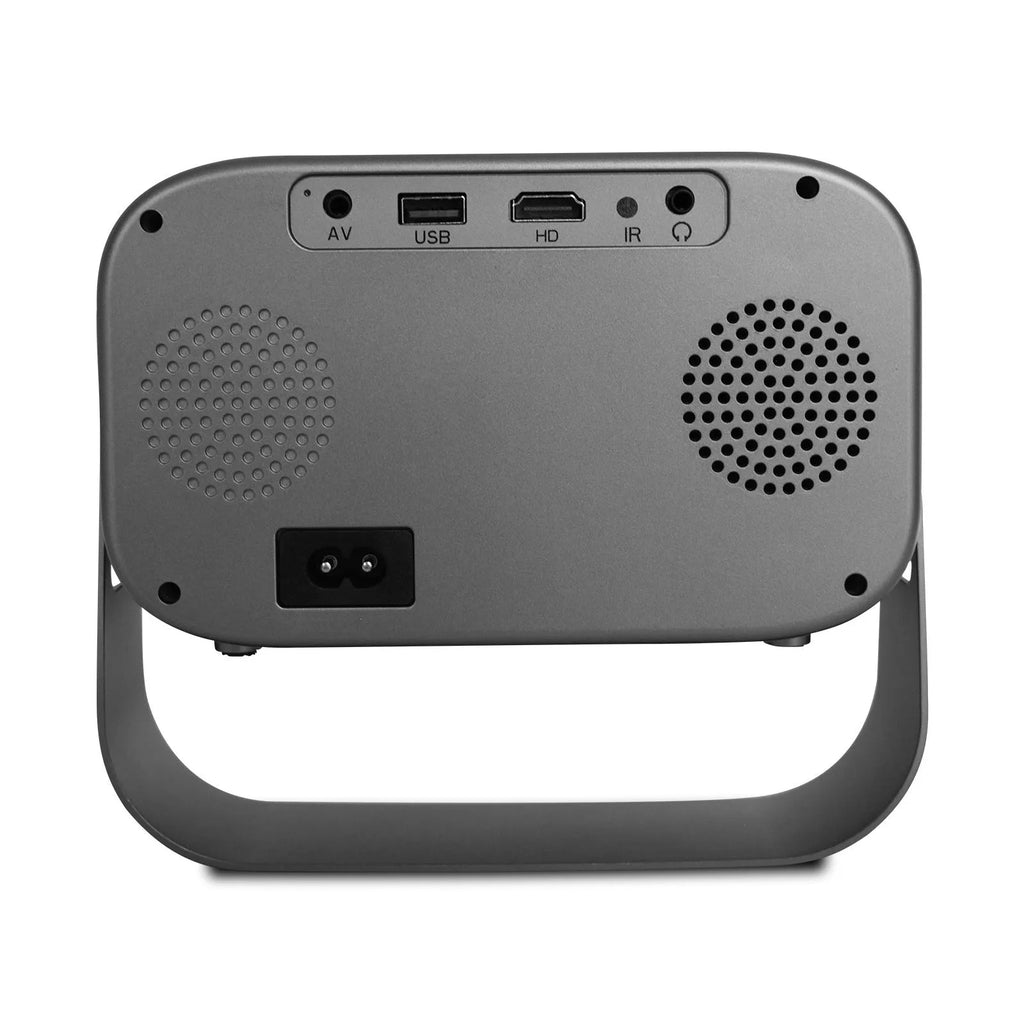 Black HD portable projector with Android system, remote control, and cables on desk