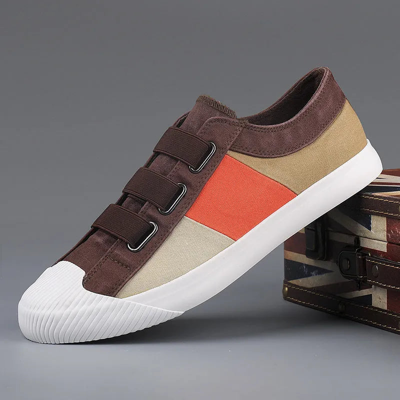 Men's beige canvas low-top sneakers with elastic band fastening and a vulcanised rubber sole.