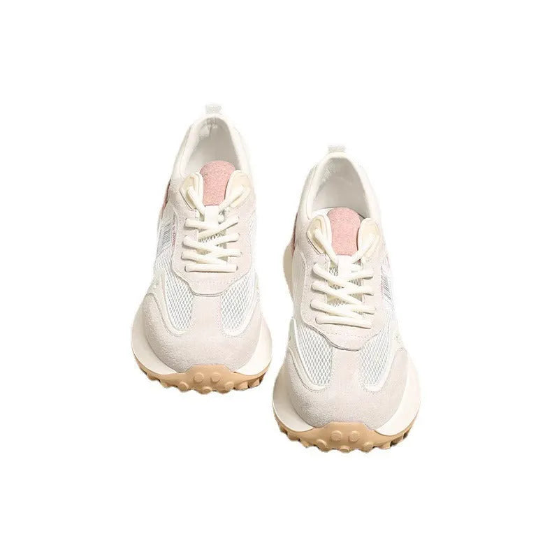 Women's low-top retro sneaker in grey with round toe, rubber sole, and mesh lining.