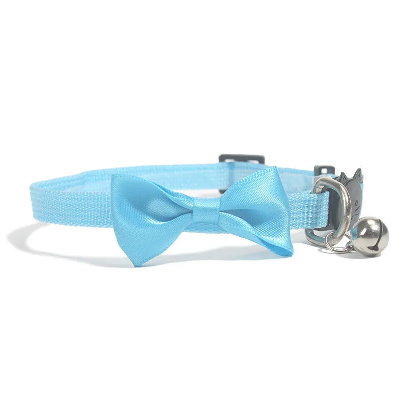 Adjustable nylon cat collar with decorative bow and bell in multiple colour options including red, blue, pink and green