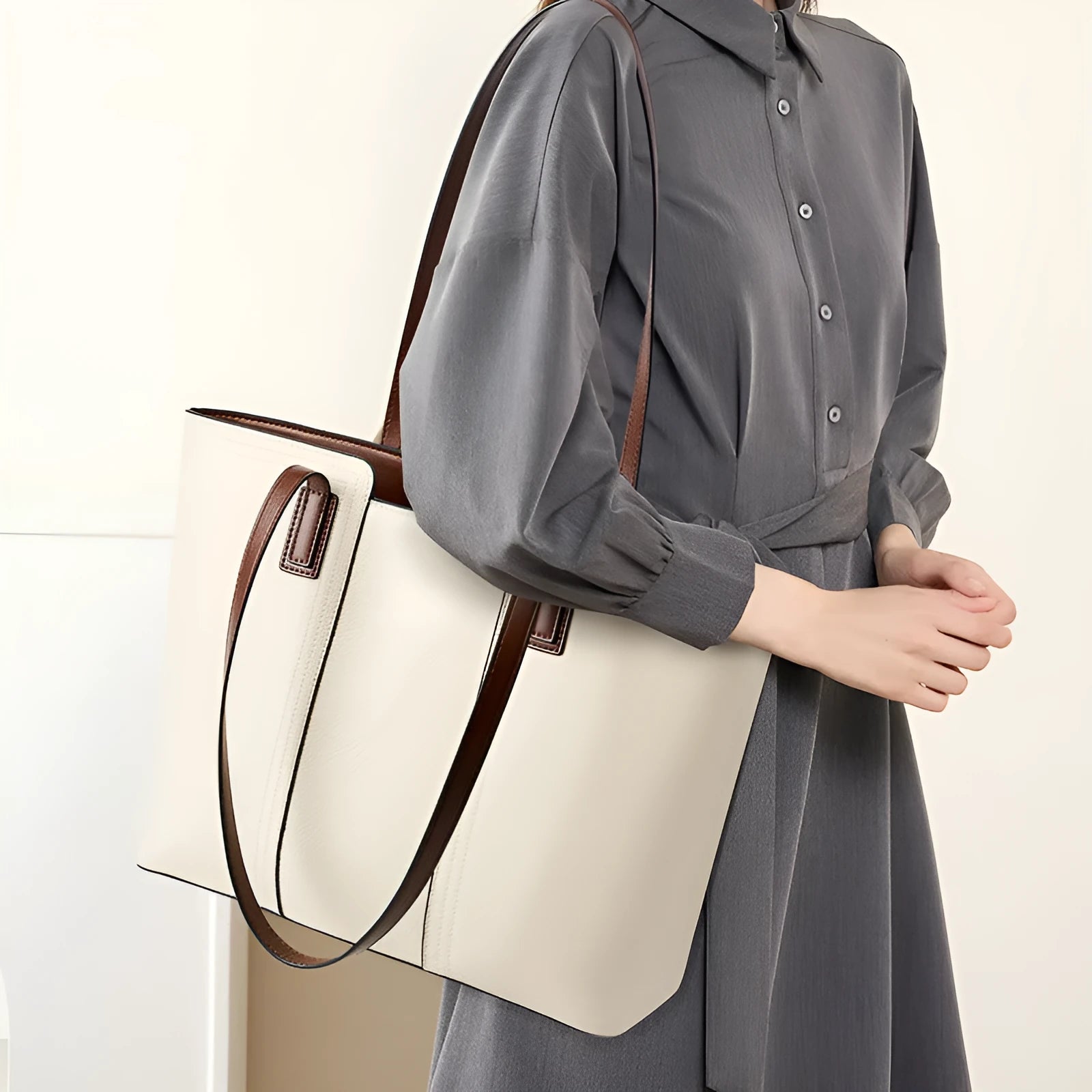 Women's genuine leather commuter shoulder bag with multiple internal zippered compartments in black colour
