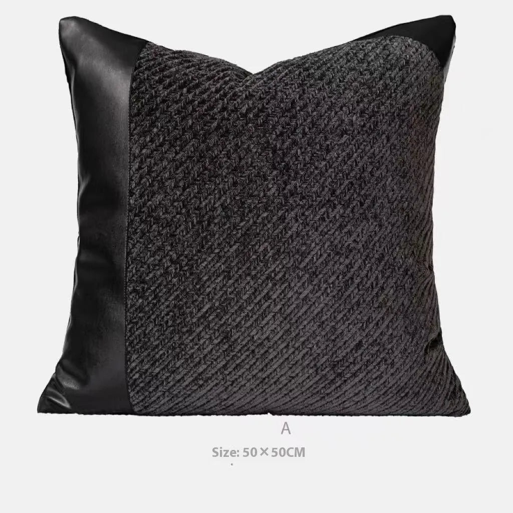 Grey and white plaid polyester bed runner blanket set with matching pillowcase and round leather-look cushion on a bed