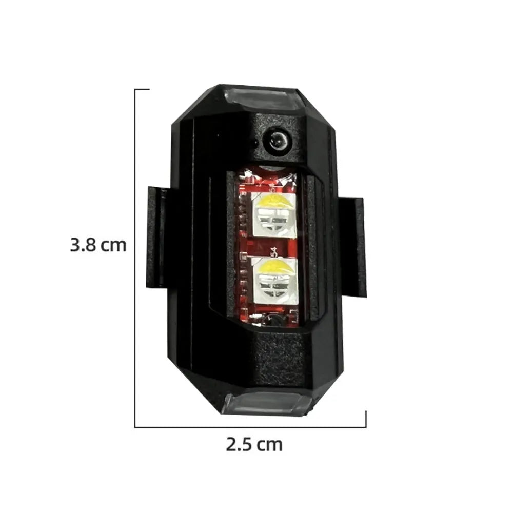 Drone signal light with RGB LED strobe, Type-C cable, fixing tape and ring belts on a table