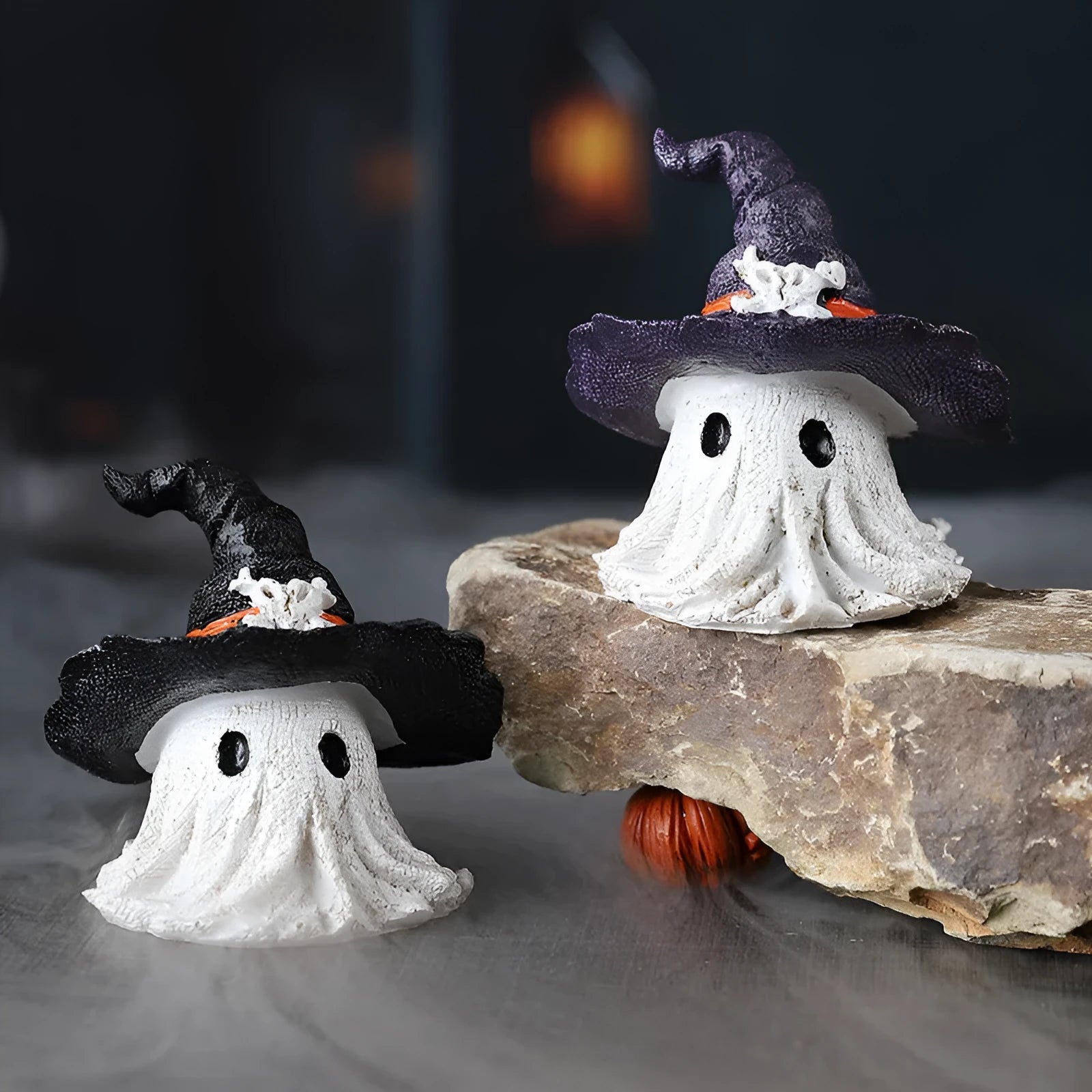 Resin wizard hat ghost ornament in black or purple for holiday decoration.