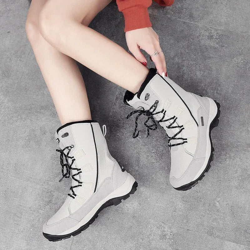 Women's genuine leather thermal snow boots in black, mid-calf length with rubber sole