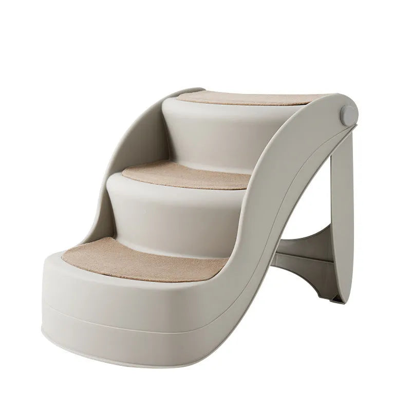 Foldable plastic pet stairs for small dogs on a carpet next to a sofa.