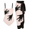 Patterned women's two-piece bikini swimsuit with a light tulle skirt.