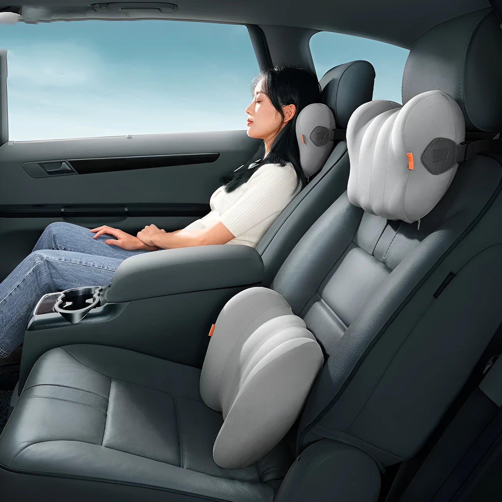 Grey and orange head restraint and lumbar pillow set for suspension bin truck cab.