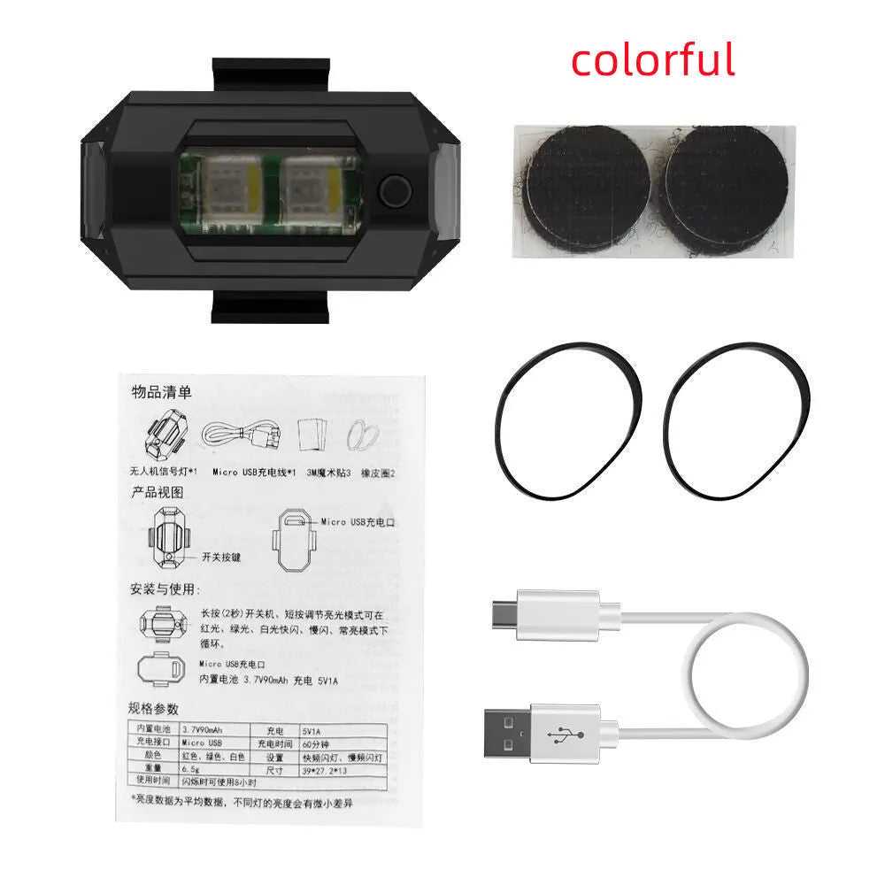 Drone signal light with RGB LED strobe, Type-C cable, fixing tape and ring belts on a table