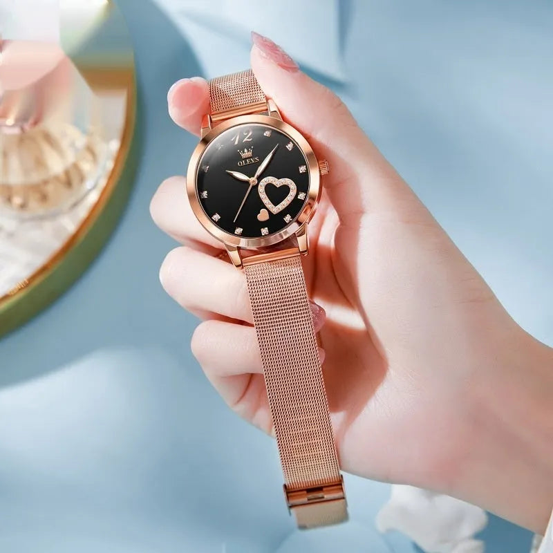 Women's fashion watch with rose gold mesh strap showing six dial colour options: white, black, blue, red, pink, green.