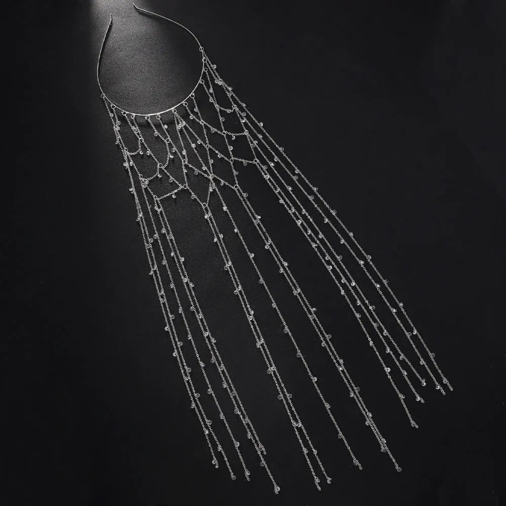 Gold and silver rhinestone mesh headband with hanging tassel details.