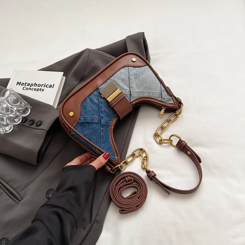 Brown denim women's shoulder bag with diamond mesh panel and chain strap showing bucket shape