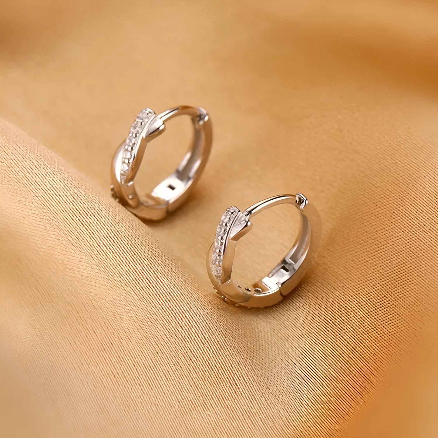 Geometric interwoven hemp rope earrings in copper with gold finish and earclip fastening