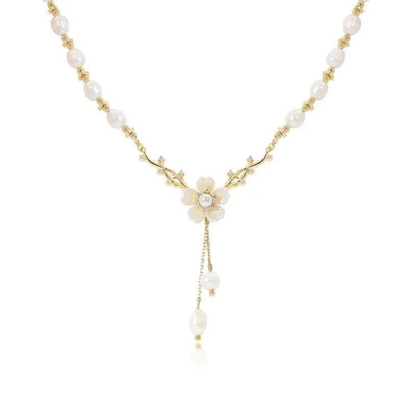 Alloy pearl necklace with floral and rose design elements on a pearl chain.