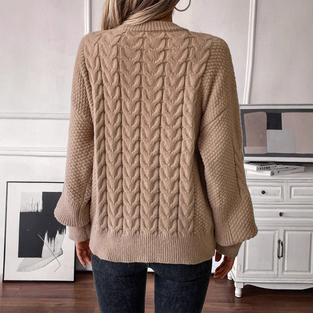 Women's khaki round neck sweater with twisted stitch detail and loose fit silhouette