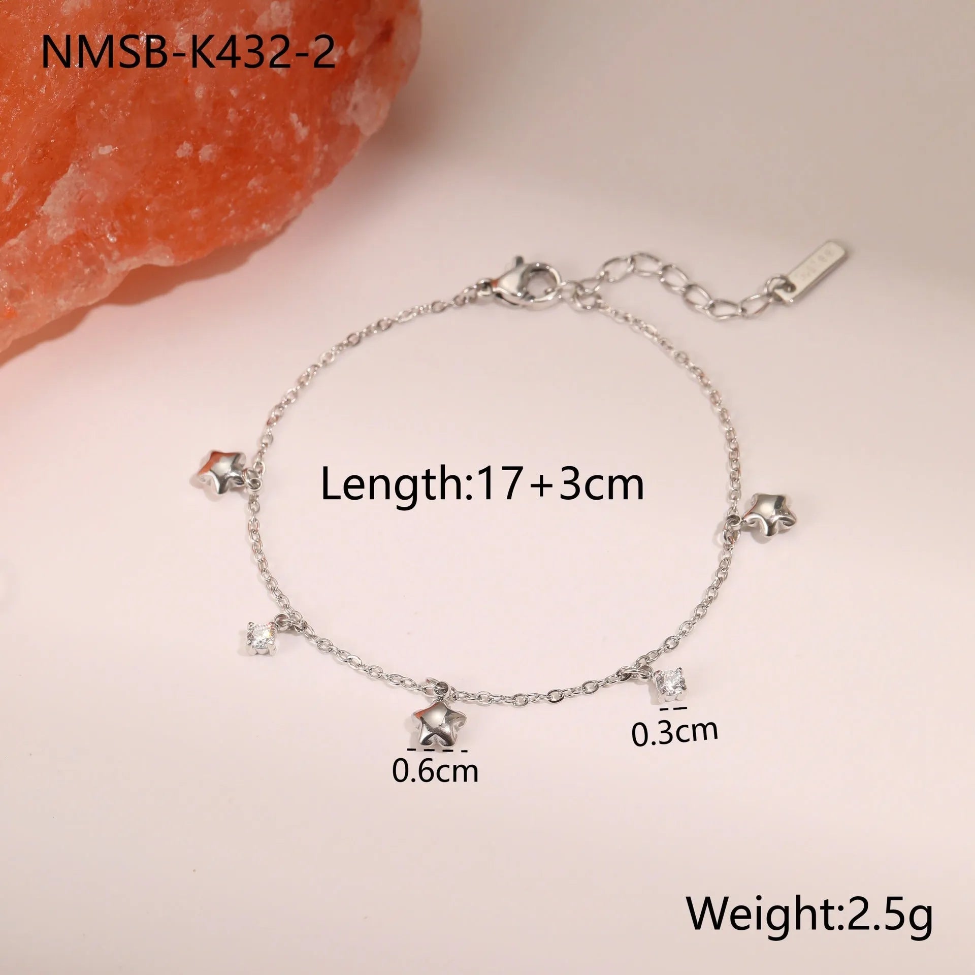 Stainless steel women's bracelet with geometric star pendant featuring hexagonal elements and gold plating