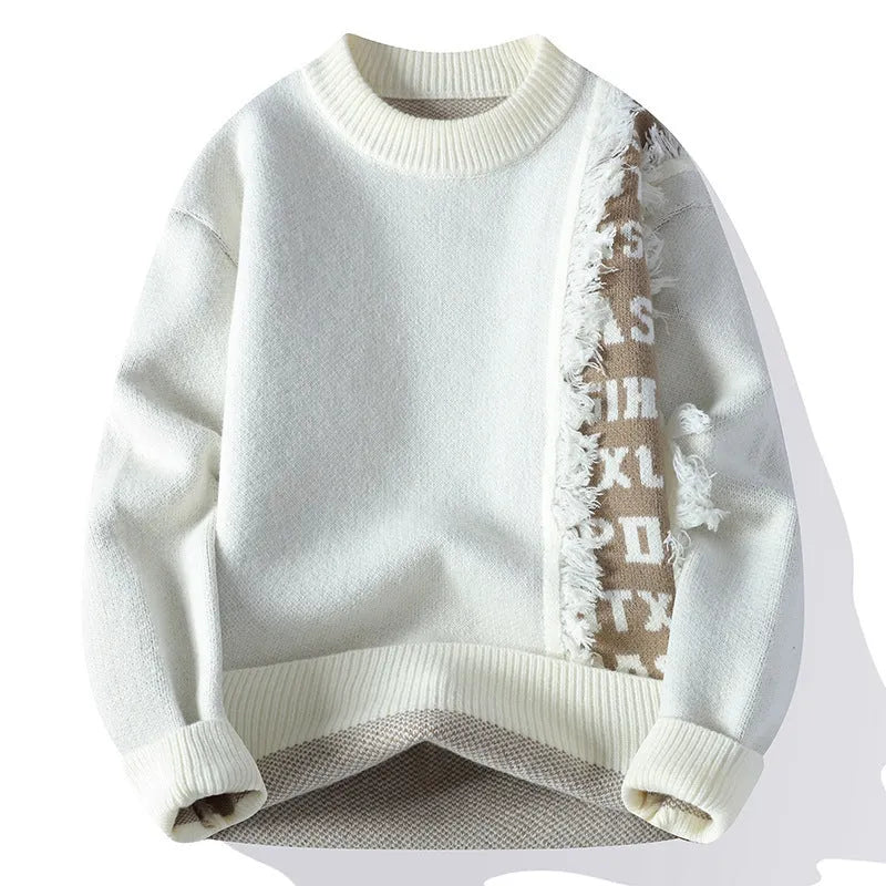 Man wearing a loose fit grey knitted pullover with ribbed hemline