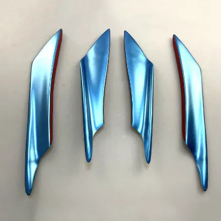 Set of four carbon fibre effect ABS plastic bumper air knife spoilers for car styling.