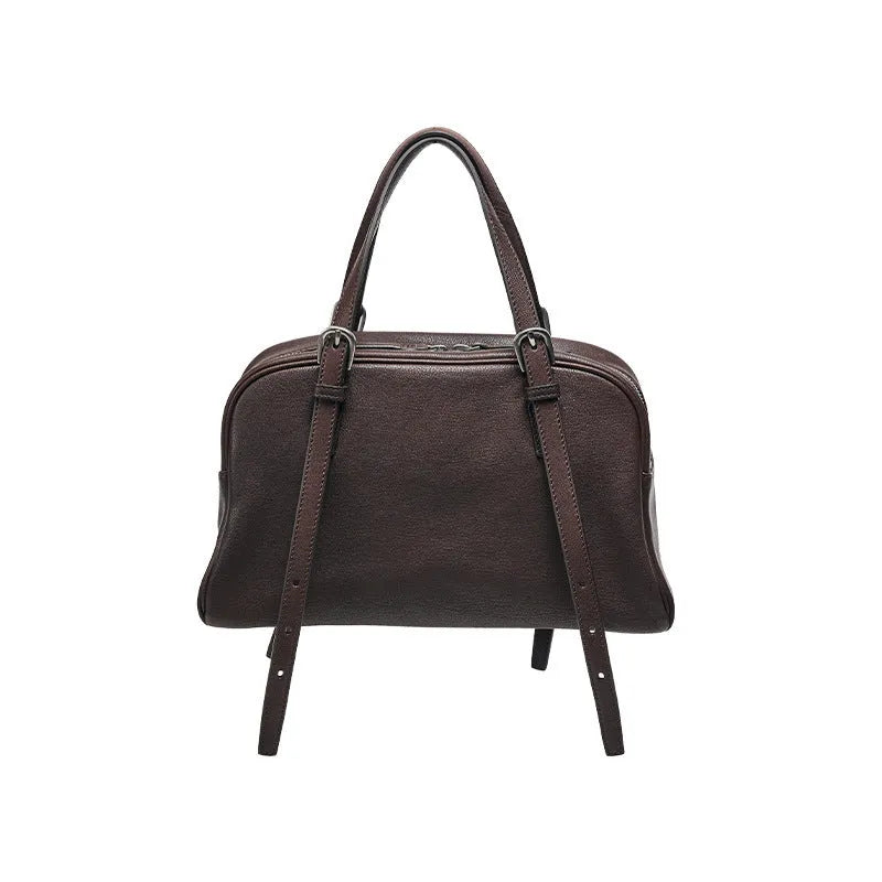 Women's black genuine leather retro shoulder bag showing horizontal square shape and double shoulder straps