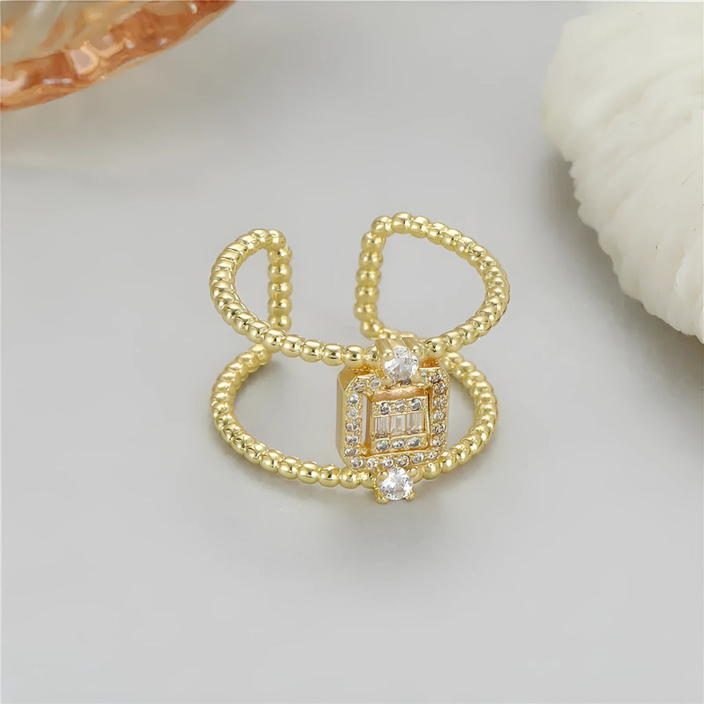 Adjustable open ring with 14K copper-plated gold finish and U-shaped asymmetric design
