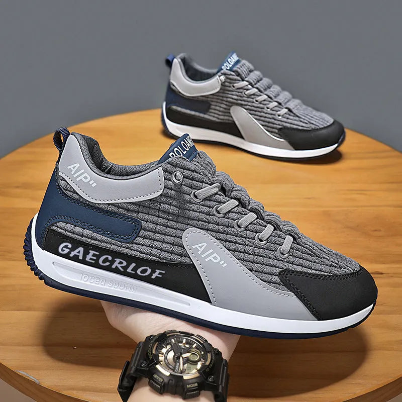 Men's low-top green mesh running shoes with white laces on a grey sole