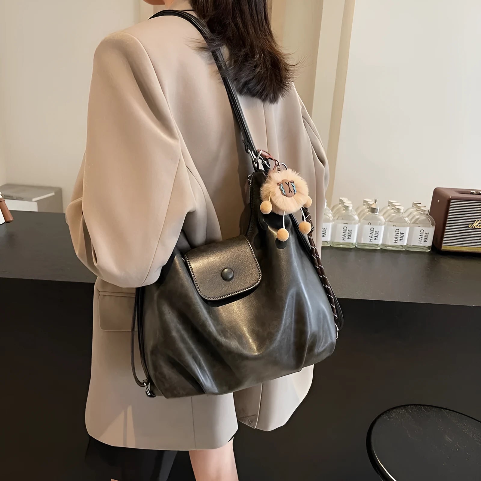 Women's black PU leather single shoulder bag with horizontal square shape and dedicated phone compartment