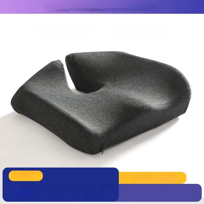 A solid grey memory foam office chair cushion for lumbar support.