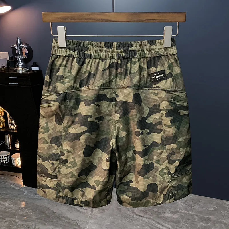 Men's camouflage cargo shorts in a loose fit with multiple pockets, shown in camouflage pattern.