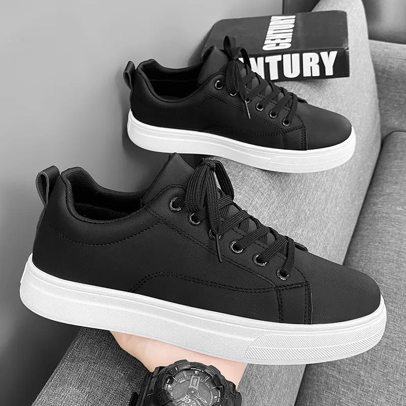 Men's low-top Korean-style sneakers in white and black colour options with round toe and flat rubber sole