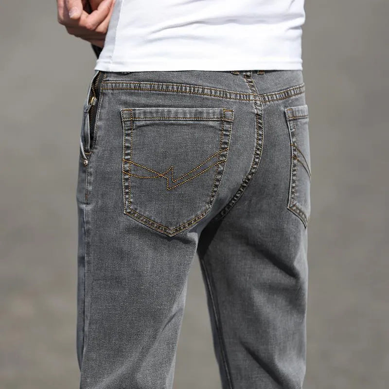 Men's smoky gray straight leg jeans with low waist and zip fly made from elastic rabbit fur fabric