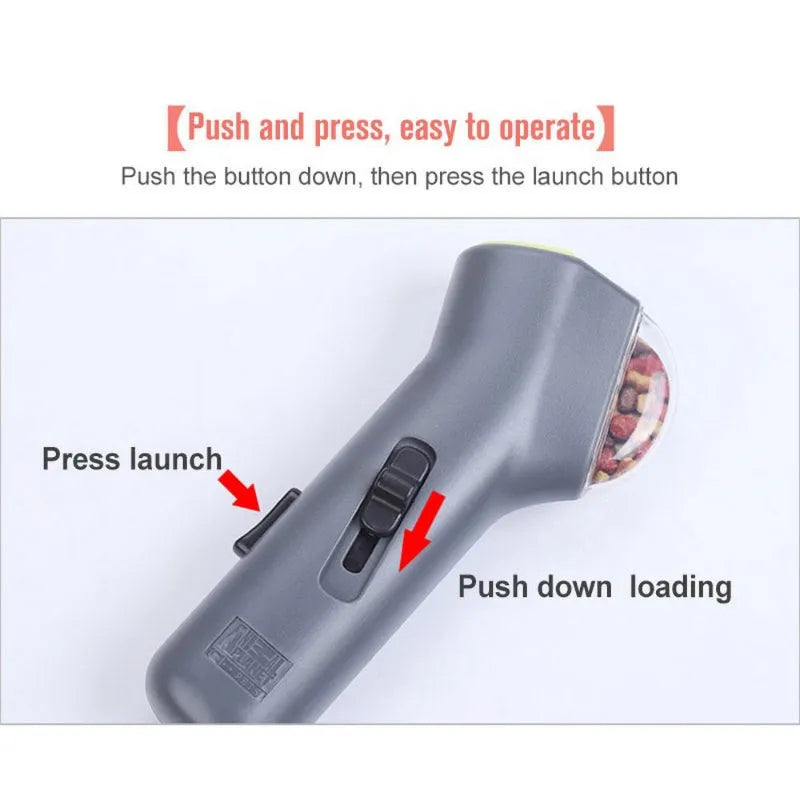 Grey plastic pet snack launcher toy with spring trigger mechanism for treat dispensing