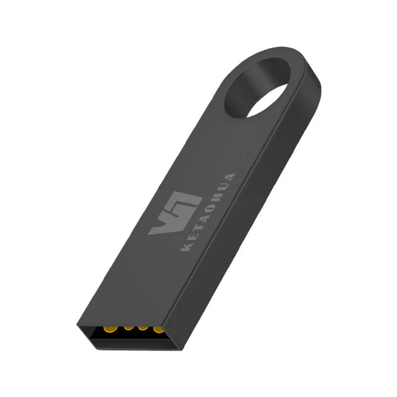 Silver metal car-shaped USB flash drive on a white background, showing USB connector.