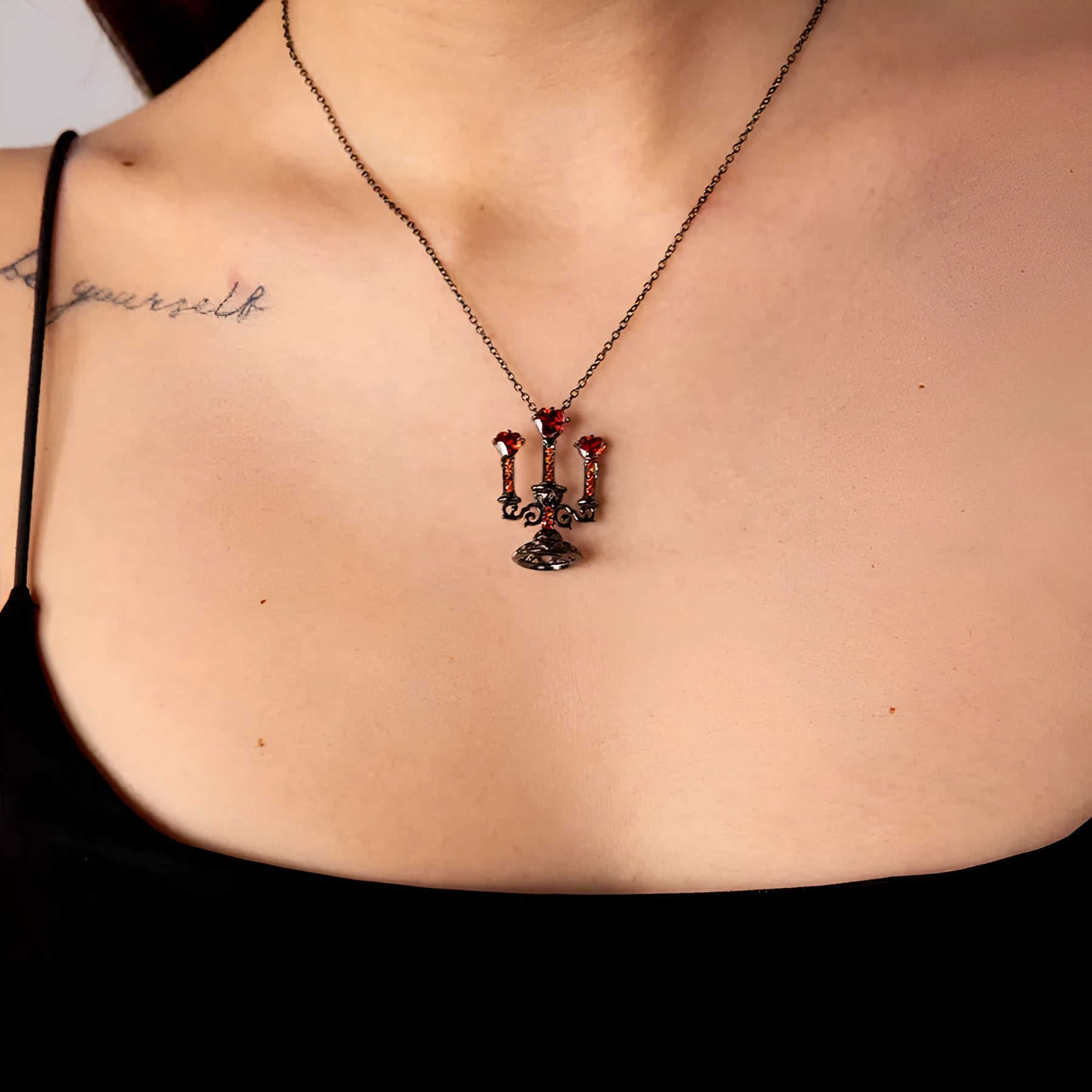 Women's retro gothic necklace with hollow candlestick pendant and cross chain in antique finish.