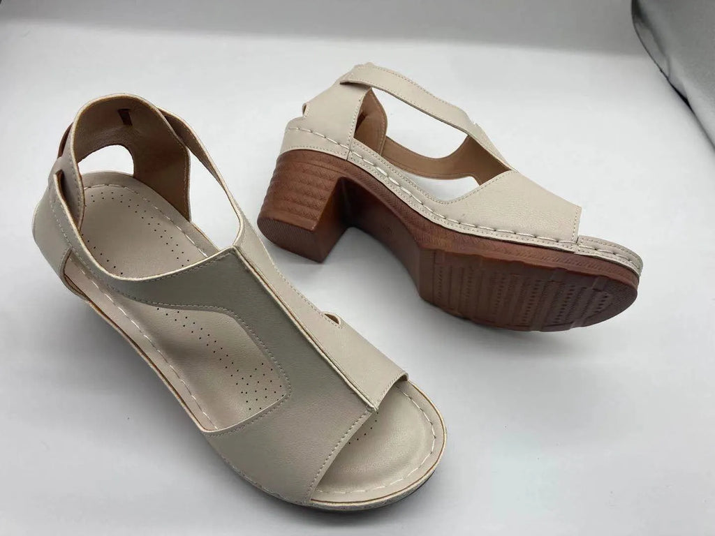 Women's peep toe wedge sandals with a buckle strap, shown in a light brown colour on a white background.