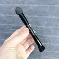 Black sponge tip concealer brush with wooden handle for dark circle coverage