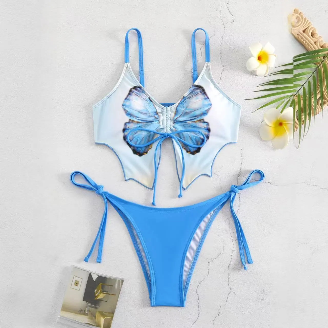 Women's purple split bow back bikini swimsuit set on mannequin, showing sleeveless top and briefs.