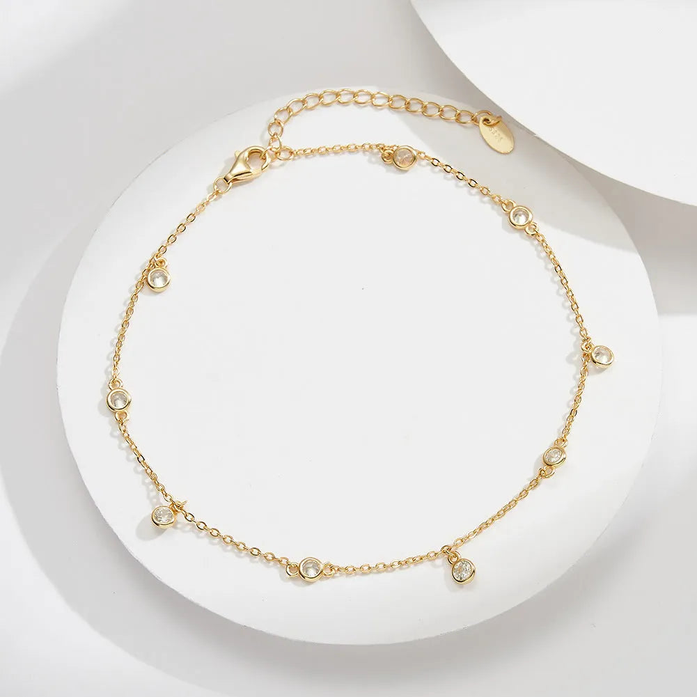 Women's sterling silver anklet with geometric zirconium pendant in gold and white gold colour options