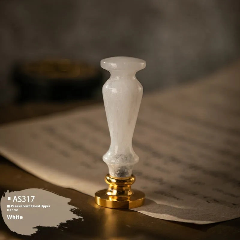 Wooden wax seal handle in a selection of different colour and decorative finishes.