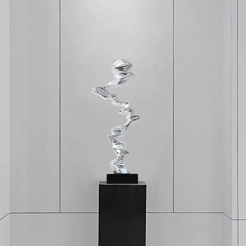 Modern minimalist abstract sculpture in natural resin, available in bright gold, elegant silver, or phantom blue.